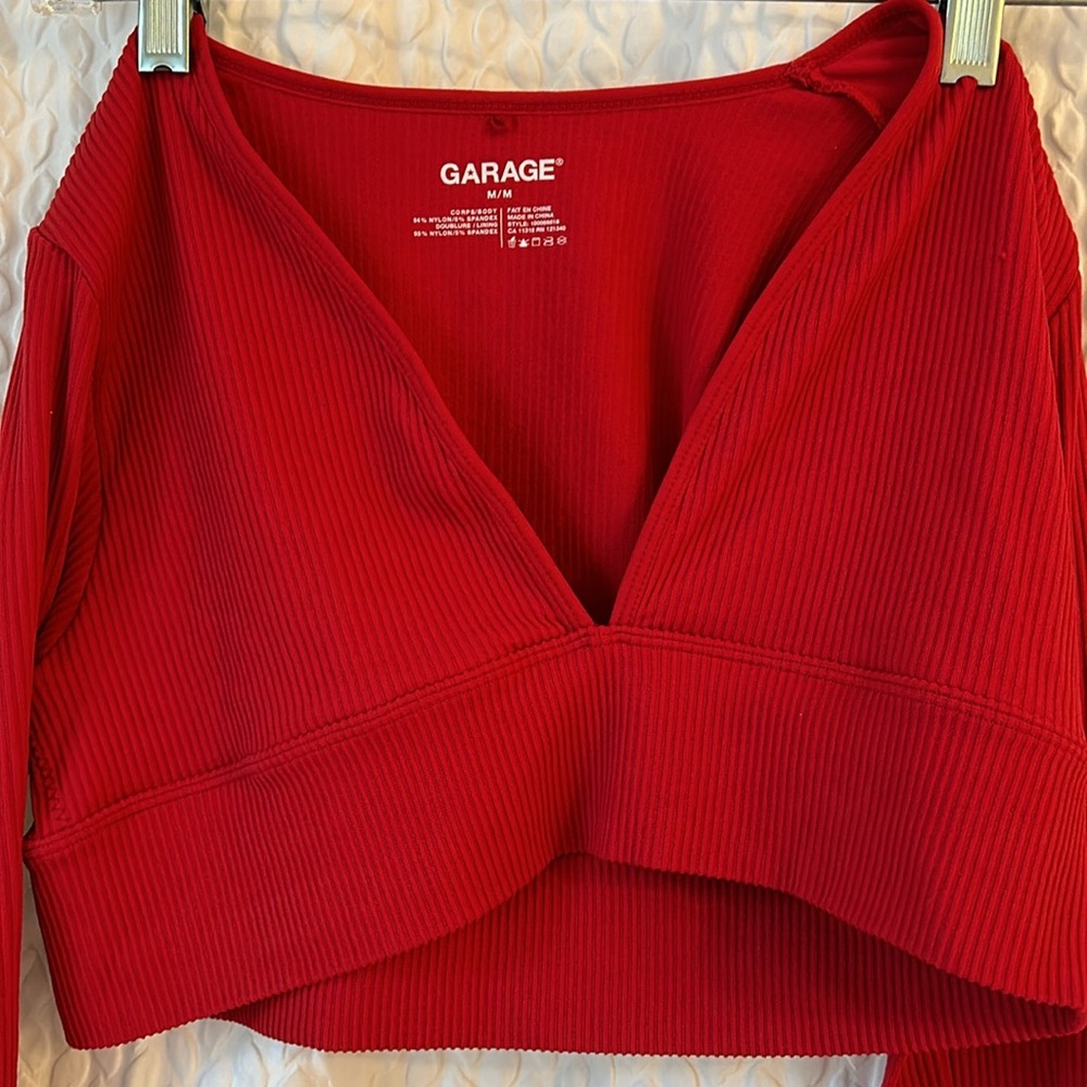 Garage Cropped Long Sleeve Ribbed Shirt with V neckline.